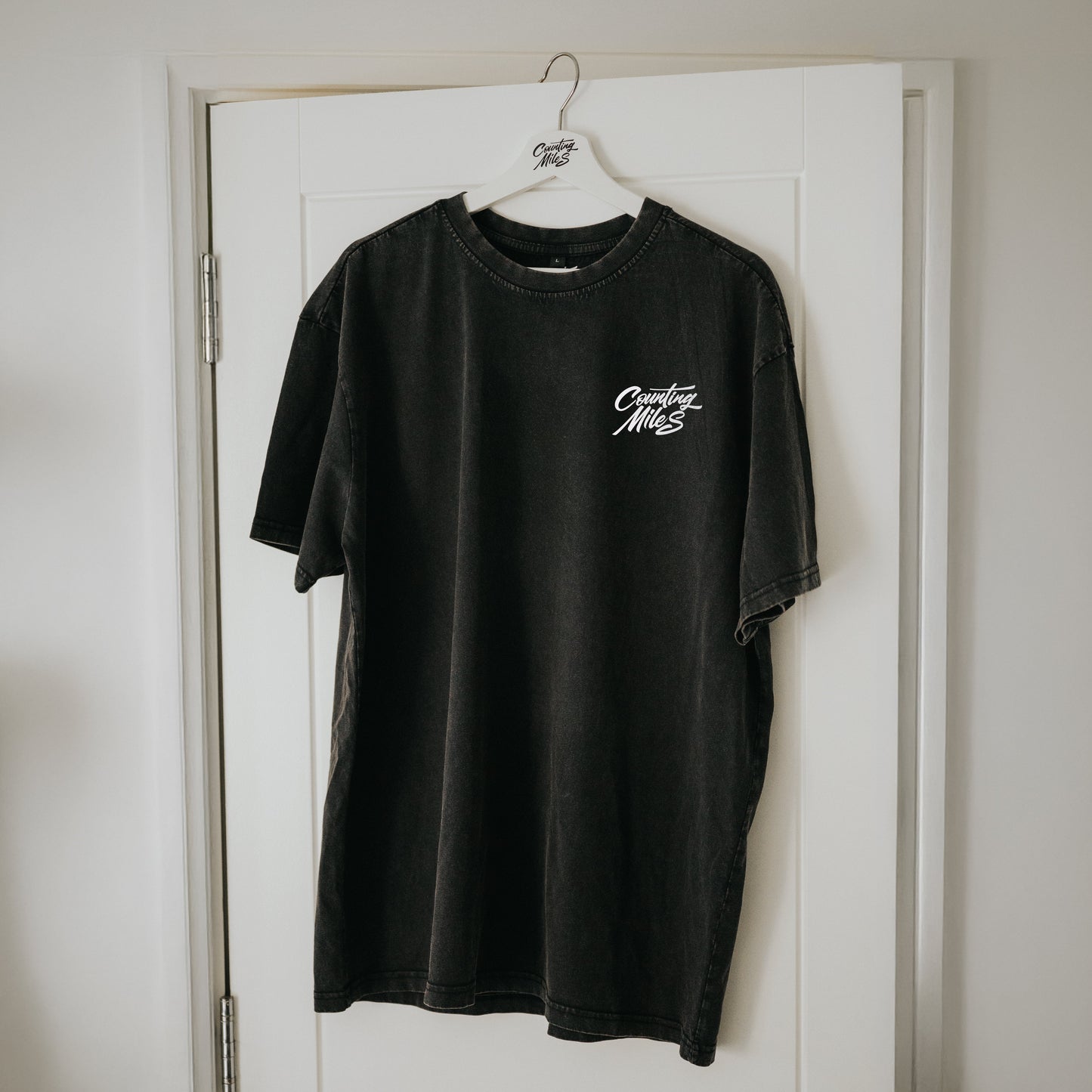 Oversized stone wash t-shirt with Counting Miles logo